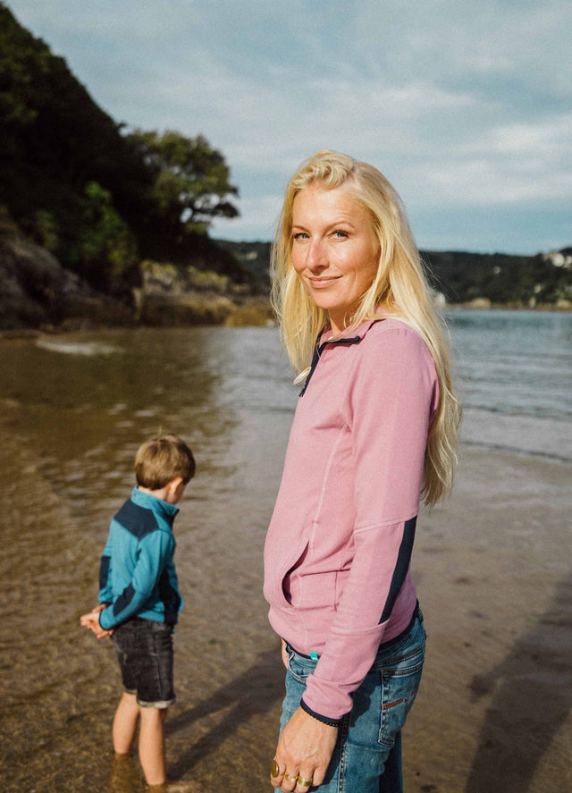 Woman wearing Jellymud bamboo pullover with contrast navy details