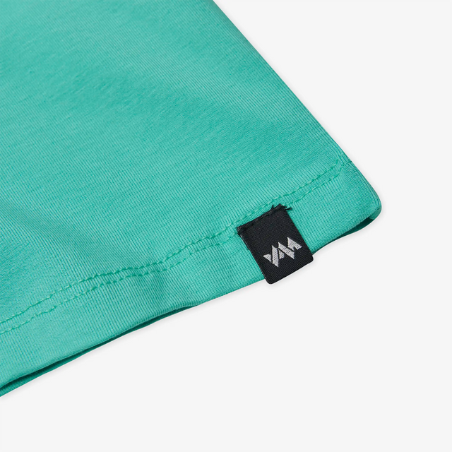 Hem detail of a Jellymud Kids Aqua Bamboo T-Shirt. This eco-friendly and soft t-shirt, made from bamboo fabric, provides comfort and style for your little ones.