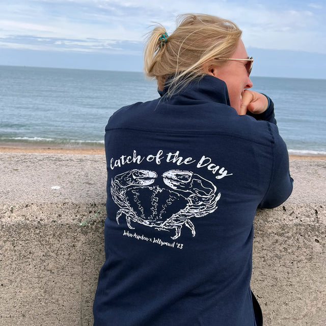 Woman wearing a John Aspden Crab Graphic Sweatshirt. A limited edition collaboration with Jellymud.